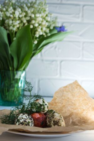 Labne balls with herbs and spices on craft paper. Traditional yogurt cream cheese in the Middle East. の写真素材