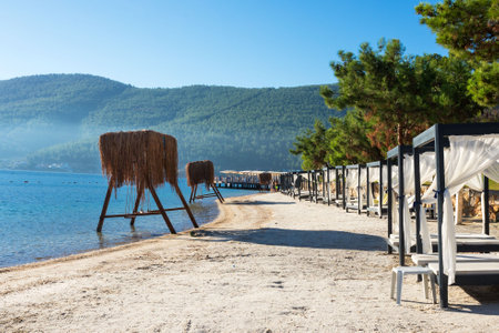 Wooden swing over the water by the sea. A cozy place for rest and relaxation. Rest in Turkey.の写真素材
