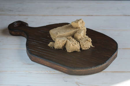 Delicious oriental dessert sunflower halva on a dark background.の写真素材