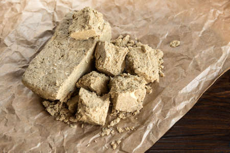 Delicious oriental dessert sunflower halva on a dark background.の写真素材