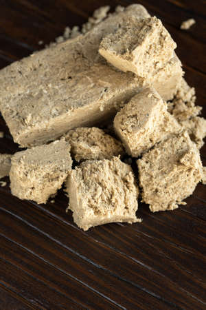 Delicious oriental dessert sunflower halva on a dark background.の写真素材