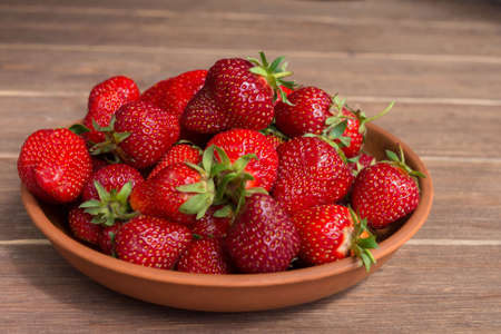 Red ripe big homemade strawberry close-up. A healthy summer berry.の写真素材