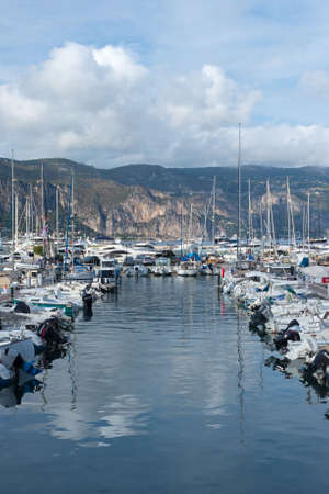 France, Nice, September 2021. Multicolored wooden boats and speedboats at a stop in Nice. Travel to...