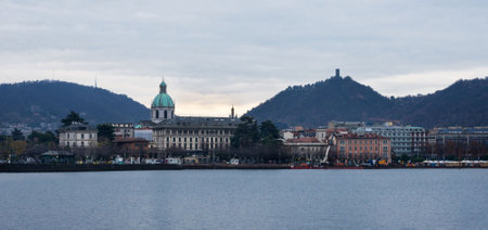 Como, Italy, November 2021. Beautiful view of the lake and the city of Como in the Lombardy region of Italy on a cloudy day. Travel Italy.のeditorial素材