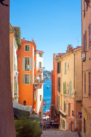 Villefranche-sur-Mer, France, September 2021. Old narrow authentic street of the city of Villefranche-sur-Mer in the French Riviera resort. Journey along the Cote d'Azur.のeditorial素材