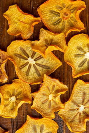 Persimmon chips. View from above. Healthy natural fruit snacks.の写真素材