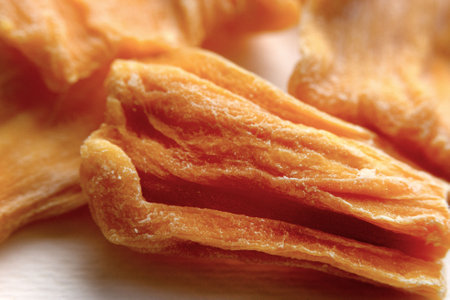 Dried jackfruit chips close-up. Dried fruits.の写真素材