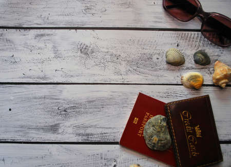 Travel document and card on wooden background.の写真素材