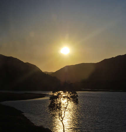 Europe - June 2009: mountain lake in the Alps. Sunset.の写真素材