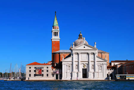 ITALY - SEPTEMBER 2011: Pictured is a church on an island in Venice. View from the water. Sunny.の写真素材