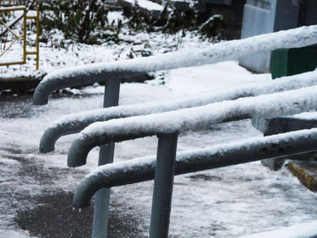 Russia - January 2019: Snow and ice covered railings near the house. Photographed in Moscow.の写真素材