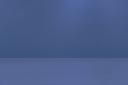 Wooden desk in front of navy blue cement wall background. Empty wood table top on navy blue background. Template mock up for display of product.の写真素材