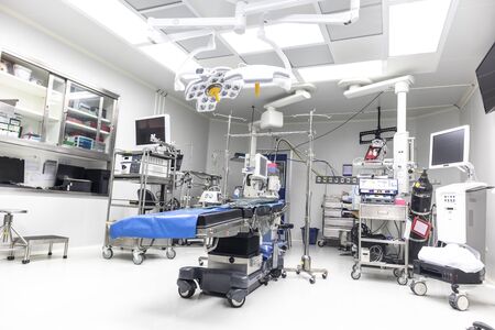 Technologically modern operating room with advanced equipment and medical devices. Empty operating room in a hospital.の写真素材