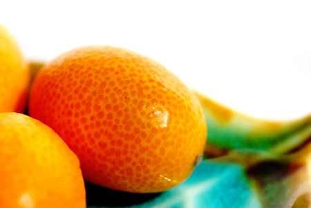 Delicious fresh citrus fruit on a plateの写真素材
