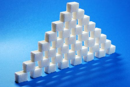 Sugar cube refined on a blue background