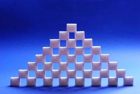 Sugar cubes refined on a blue