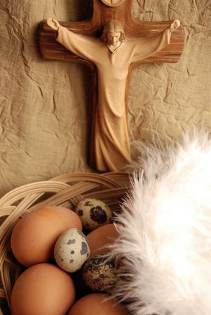 Easter eggs, wings and crucifixion close up