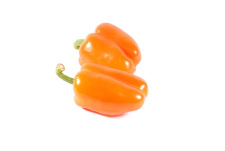 Two orange sweet peppers isolated over white backgroundの写真素材