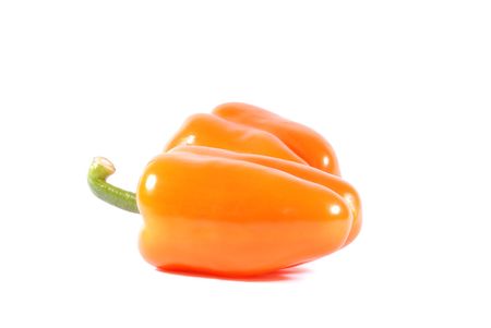 Two orange sweet peppers isolated over white backgroundの写真素材