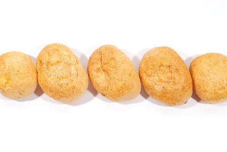 Five fresh buns over white backgroundの写真素材