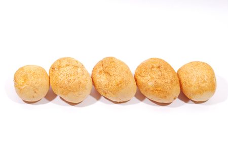 Five fresh buns over white backgroundの写真素材