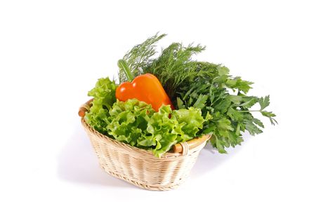 Parsley, dill, pepper and lettuce in basket on white backgroundの写真素材