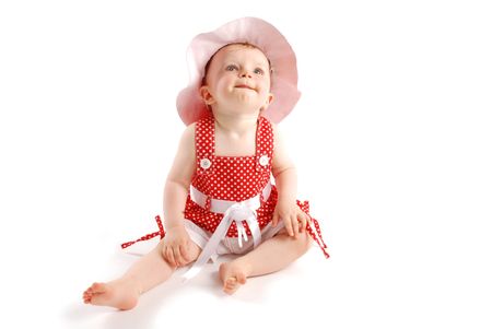 Littli baby girl in red dress and hatの写真素材