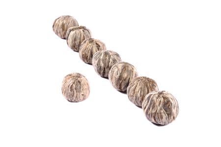 Balls of white tea over white backgroundの写真素材