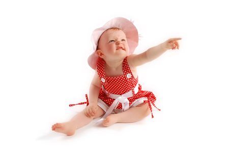 Little baby girl in red dress and hatの写真素材