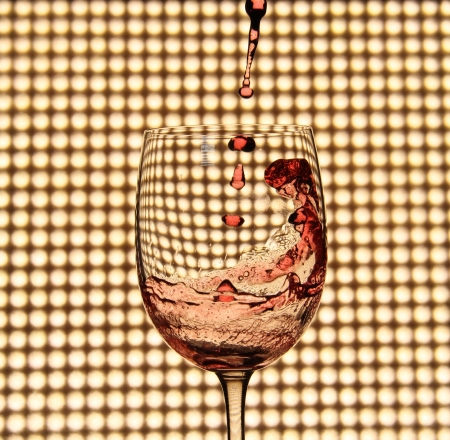pouring red wineの写真素材