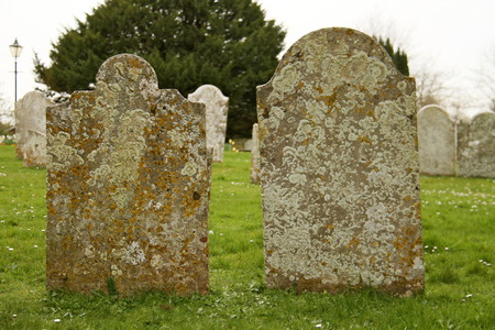 old grave stones in a cemetery,