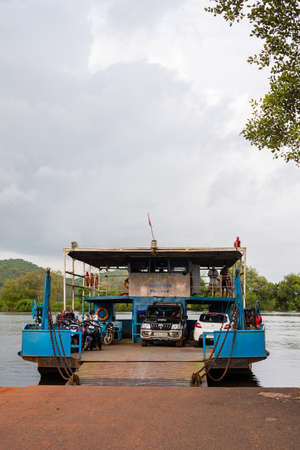 Goa, India September 15th 2021, Locals onboarding the ferry boat on foot and on their vehicles which will take them across to Shiroda in Goa in the absence of a bridge between the land massesのeditorial素材