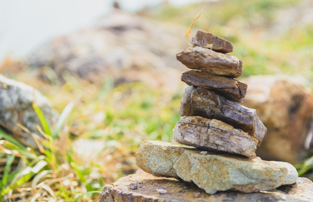 6 small stones were stack on the big stone.