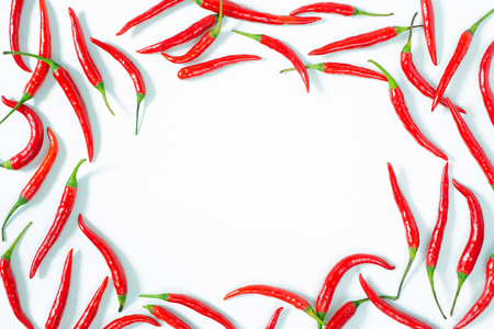 frame with chili peppers on white background. flat layの写真素材