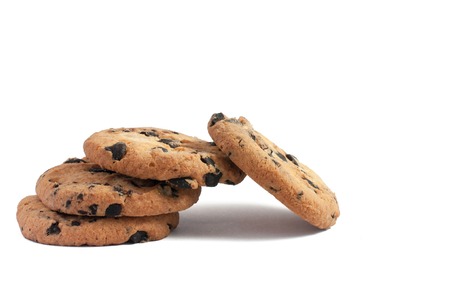 delicious cookies with chocolate stacked in a pile one on top of cookies on a white backgroundの写真素材