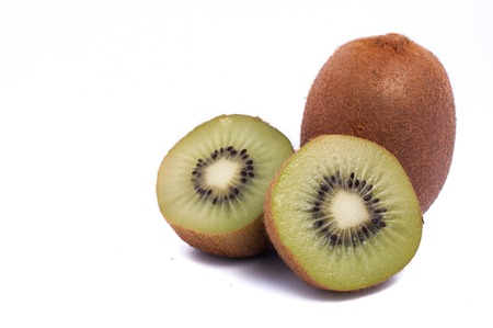 Fresh organic kiwi one whole and two half isolated on white backgroundの写真素材