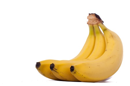 three natural bananas isolated on white backgroundの写真素材