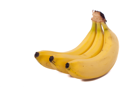 three natural bananas isolated on white backgroundの写真素材