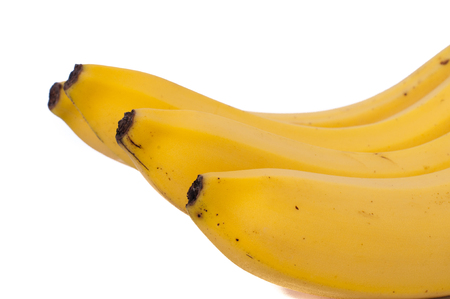 three natural bananas isolated on white backgroundの写真素材