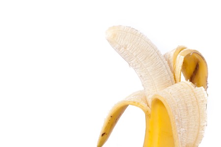Half peeled natural banana on a white Clipping Pathの写真素材