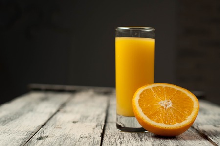 fresh Orange fruit cut and orange juice on wooden table background,の写真素材