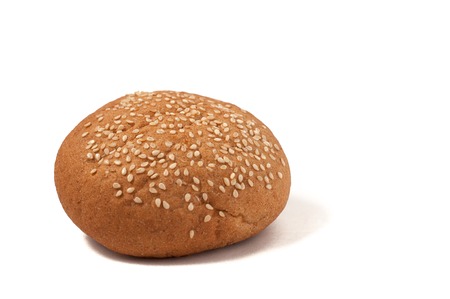 Hamburger bun with sesame seeds isolated on white backgroundの写真素材