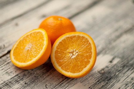 Orange fruit on wooden backgroundの写真素材