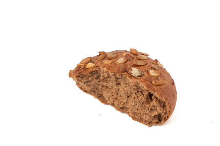 small round a bun with pumpkin seeds isolated on a white backgroundの写真素材