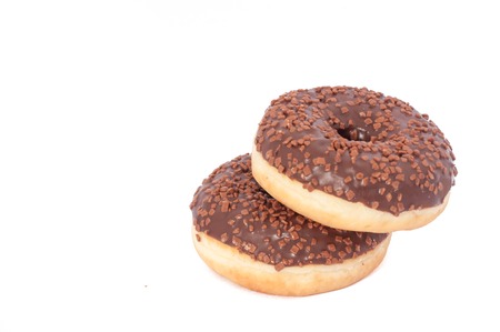Two Chocolate Donuts with Sprinkles. Isolated on a White Background.の写真素材