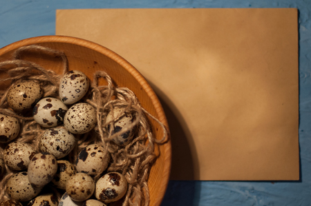 empty envelope, quail eggs on a blue backgroundの写真素材