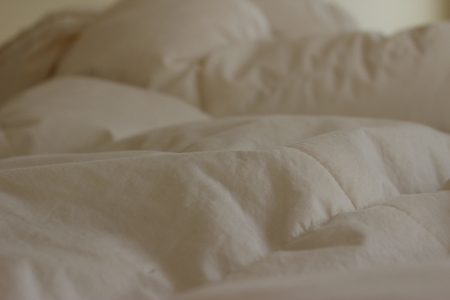 Abstract Whit cozy duvet close up backgroundの写真素材