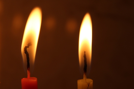 Colorful Chanukah candles lit in the menorah, Colorful Hanukkah candles are arranged in the Menorah according to the days of the holidayの写真素材