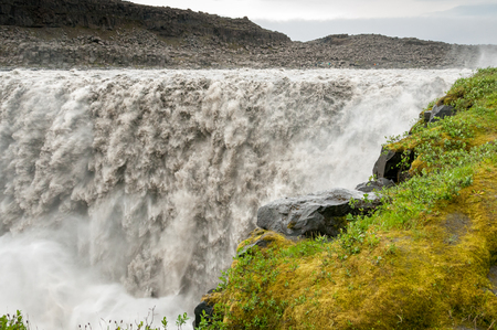 The Dettifoss waterfall, considered the most powerful in Europe, pours tons of muddy water into northern Islanceの写真素材