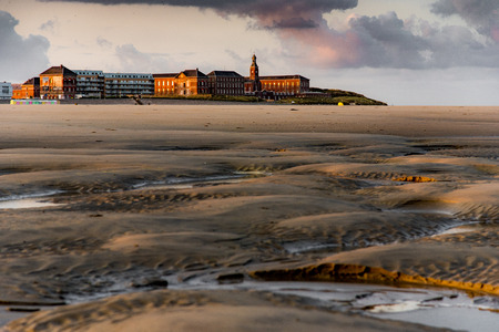 Red and old brick buildings behind Berck beach at sunriseの写真素材